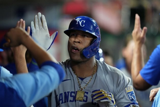 Royals belt three homers, win opener vs. Angels