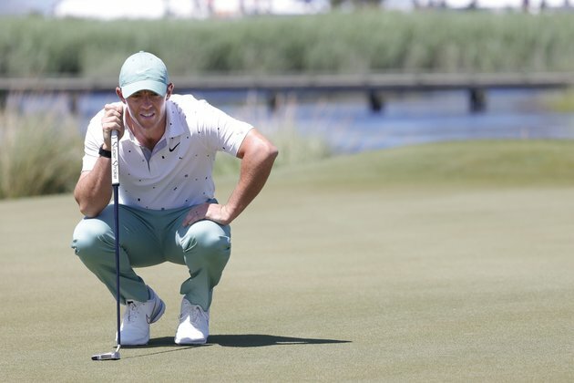 Rory McIlroy says PGA Tour should ban green books