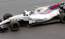 A Williams F1 car racing in Malaysia in 2017.