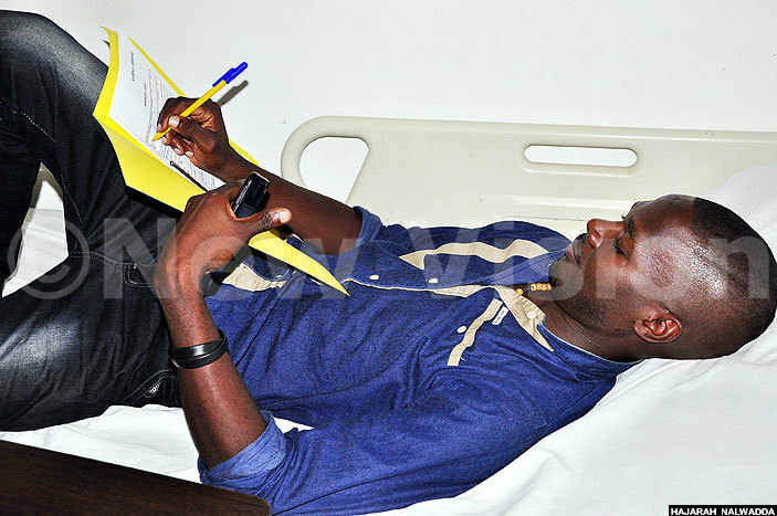  ere wanga signs hospital admission forms at ampala ospital on uesday e has since returned home after his operation was delayed
