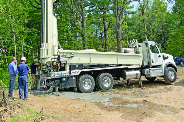 The Geoprobe DM650 air rotary drill rig provides time-saving features like backloading carousel and top head side shift