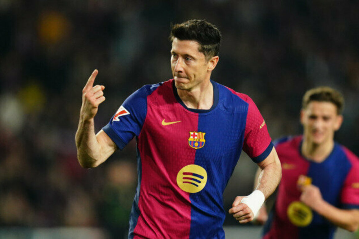 Barcelona edge Rayo Vallecano to claim top spot on Lewandowski penalty