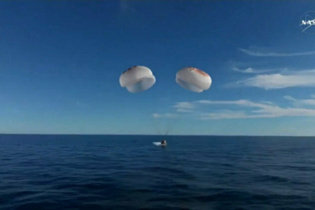 Astronauts stranded in orbit return to Earth 