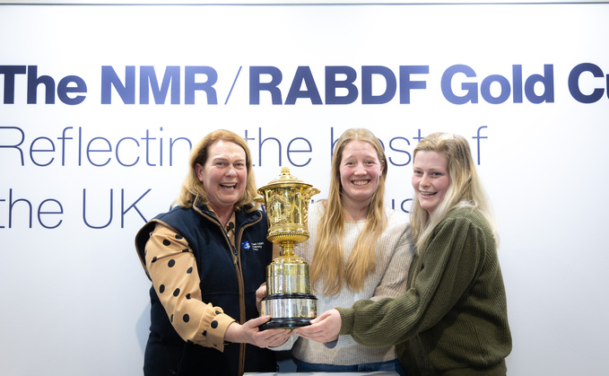 Left to right: Kate Robinson, Alice Sault and Becky Yarnold collecting the Gold Cup.