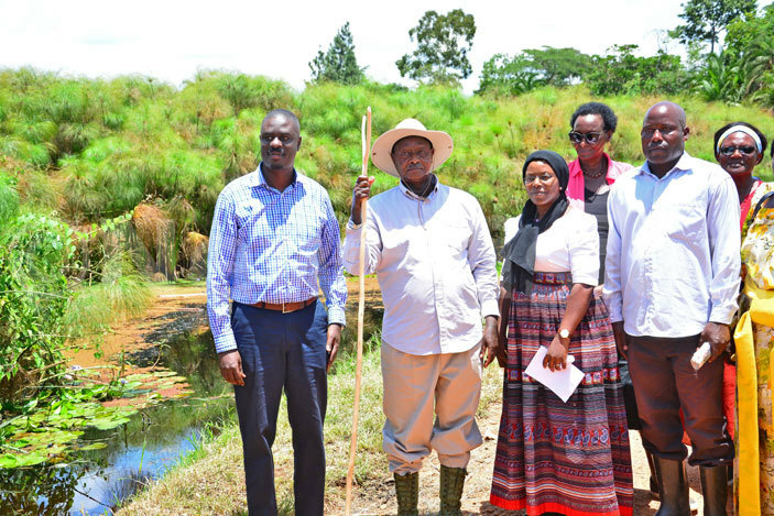 useveni with the luwero triangle minister ennis alabuzi and woman mp uweero illian akate infront of river anze 