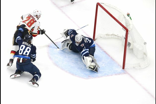 Flames rout Jets, grab 2-1 series edge