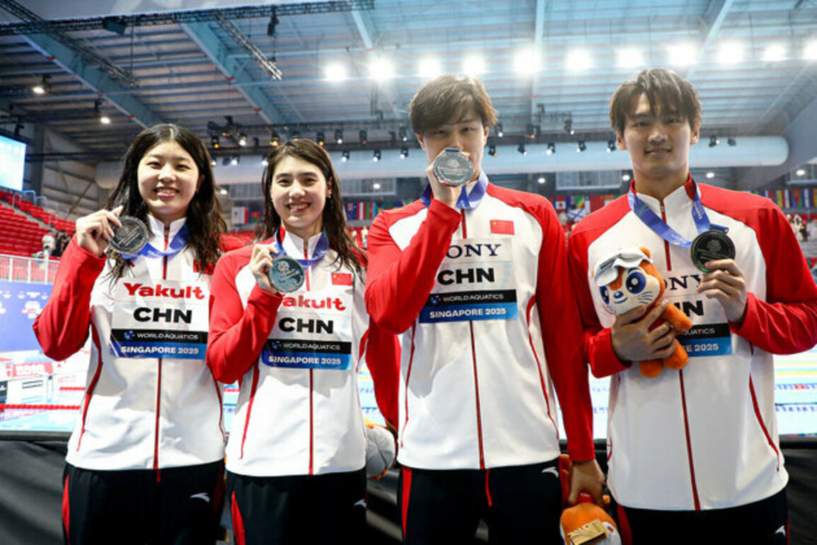 China adds 2 silvers, Marchand sets world record at Singapore Worlds