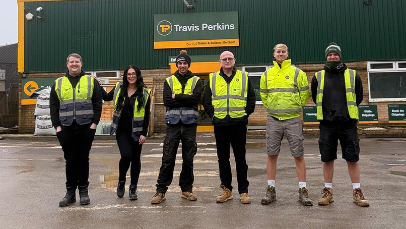 Eddy Webb  and Brian Kent (centre), with colleagues from Travis Perkins' Chipping Norton branch.