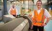 Dr Moser and executive general manager Michael Freyny next to a specialised test-bed for electric motors