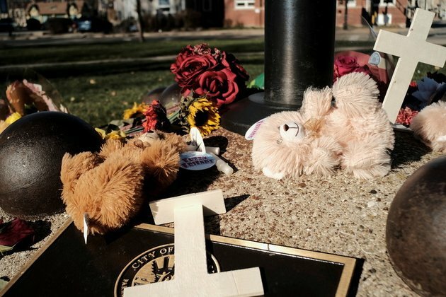 Child dies, bringing parade massacre toll to six as suspect charged