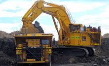 The Komatsu PC7000 loading a truck.