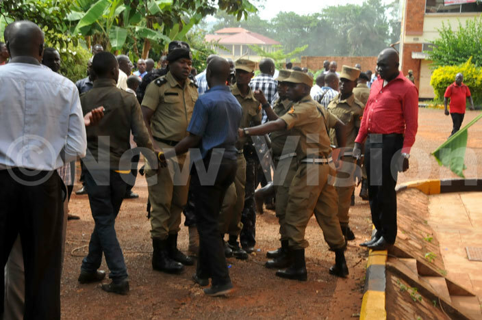 olice officers arresting one of the youth who was causing chaos icture by onald iirya