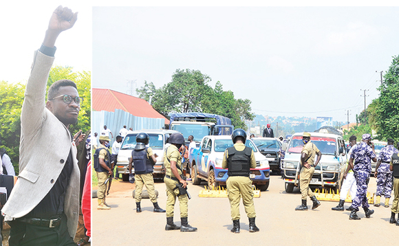 Poliisi ng’esudde emisanvu ku luguudo lw’e Gayaza, ‘Ku Mbuzi’ okutangira abawagizi ba Bobi (ku kkono) abaabadde bamugoberera mu mmotoka. Poliisi ng’esudde emisanvu ku luguudo lw’e Gayaza, ‘Ku Mbuzi’ okutangira abawagizi ba Bobi (ku kkono) abaabadde bamugoberera mu mmotoka.