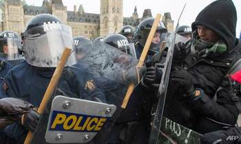 Counter protesters clashed with police during the far right rally against the un international pact on migration 1544304158140 2 350x210