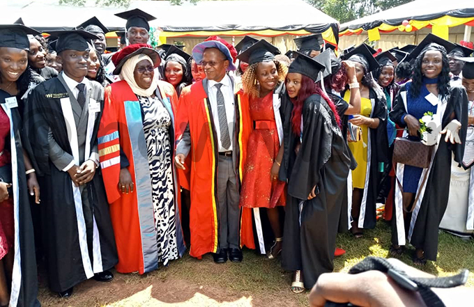 tate minister for higher education ohn hrysostom uyingo with some of the graduands hoto by ercy korom