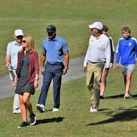 Line forming to recruit Charlie Woods ('27) with Tiger along for ride