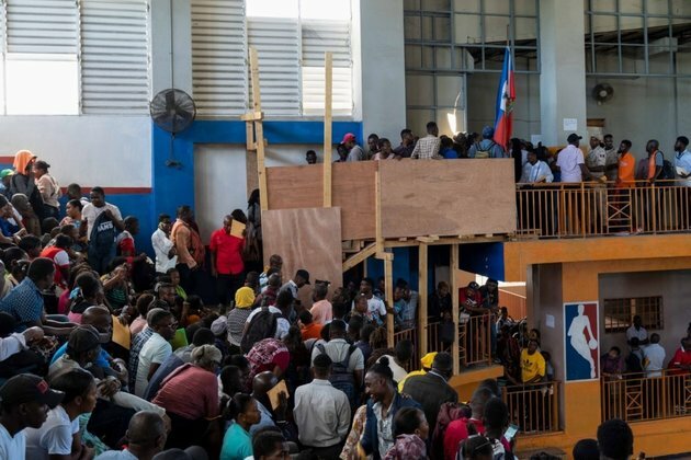 Haitians Seen Crowding Into Migration Centers Seeking Passports To US