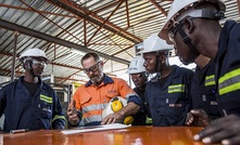 Kal Tire team members participate in the daily safety briefing prior to commencing work on a site in Mozambique