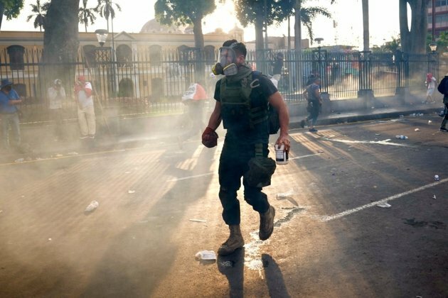 Peru&#039;s Protest Deactivators Run Toward Tear Gas to Stop It
