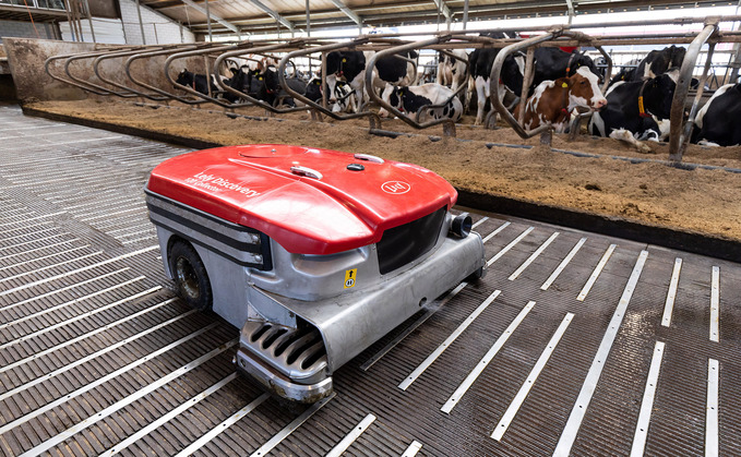 The vacuum-based system collects slurry as it works around cubicle housing.