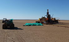  Raglan Drilling's rig on the surface of Lake Goongarrie