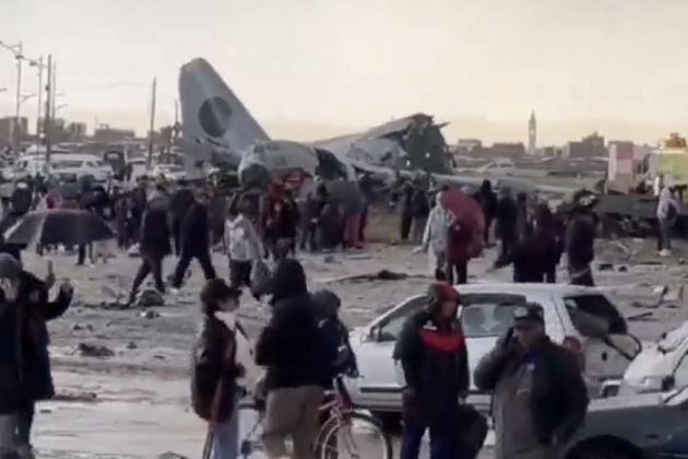 Currency notes litter ground as plane crashes in Bolivia, killing 15