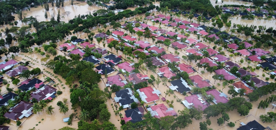 Aceh Utara, Indonesia - 26 November 2025 : aerial view of the flooded PT Pupuk Iskandar Muda complex