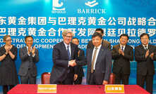 Barrick executive chairman John Thornton (centre left) and Shandong Gold chairman Chen Yumin