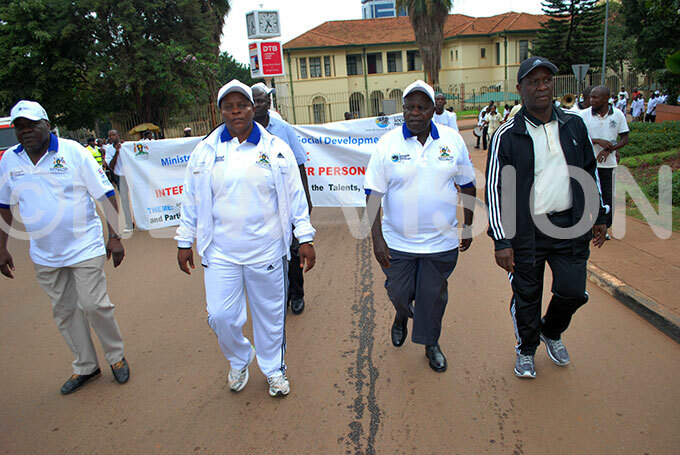  he minister of state for gender and culture eace utuuzomiddle leads the healthy walk for older persons 