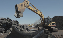 Tyres are cut prior to being shredded at this recycling facility