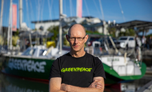 CEO David Ritter, Greenpeace Australia, stands in front of the Oceania vessel during the Naming Ceremony. Credit: Greenpeace