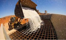 The first bucket of Lake Way salt being fed into the hopper.