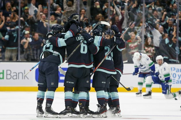 Canucks rally in 3rd to spoil Kraken's home opener