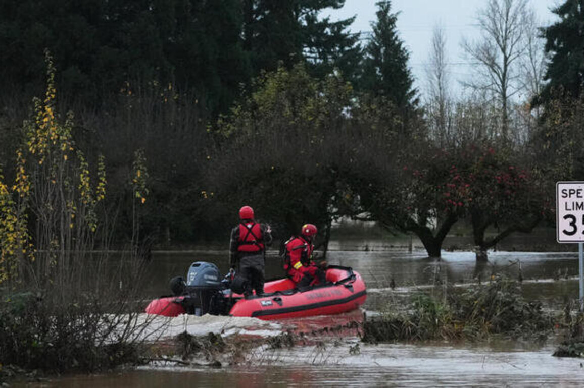 Tens of thousands evacuate as rains swell rivers in US and Canada