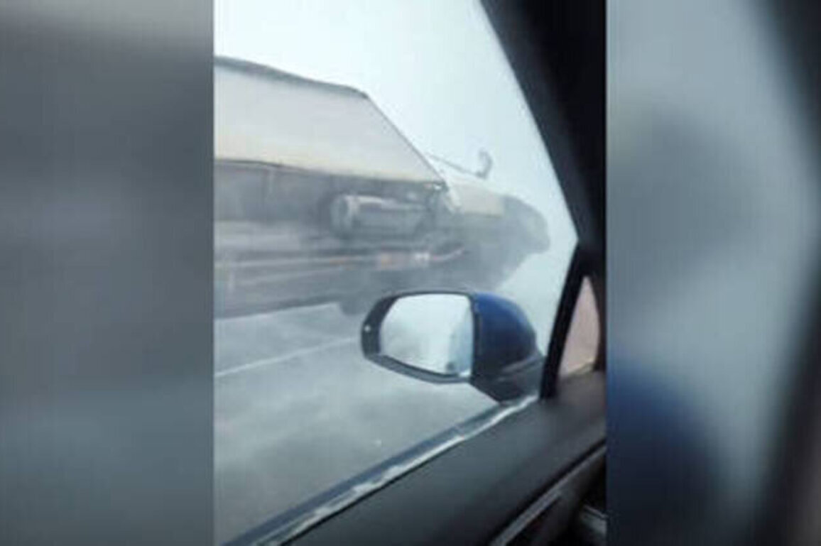 WATCH brutal blizzard flip truck over in Russia