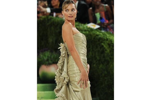 Margot Robbie returns to Met Gala in intricately embroidered gold Chanel gown