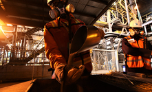 SOROWAKO, INDONESIA - AUGUST 1, 2019: A worker shows the results of the production of nickel ore.