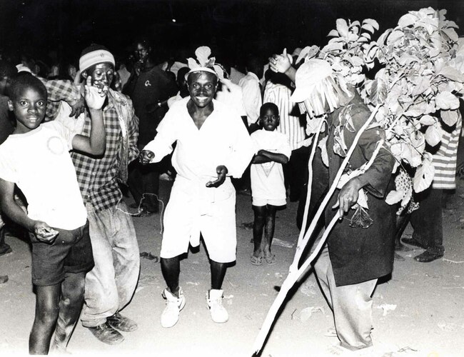  esidents of ajjanankumbi celebrating ew earss ay anuary 1st 1997 at a public disco held in front of the ision bar in ajjanankumbi