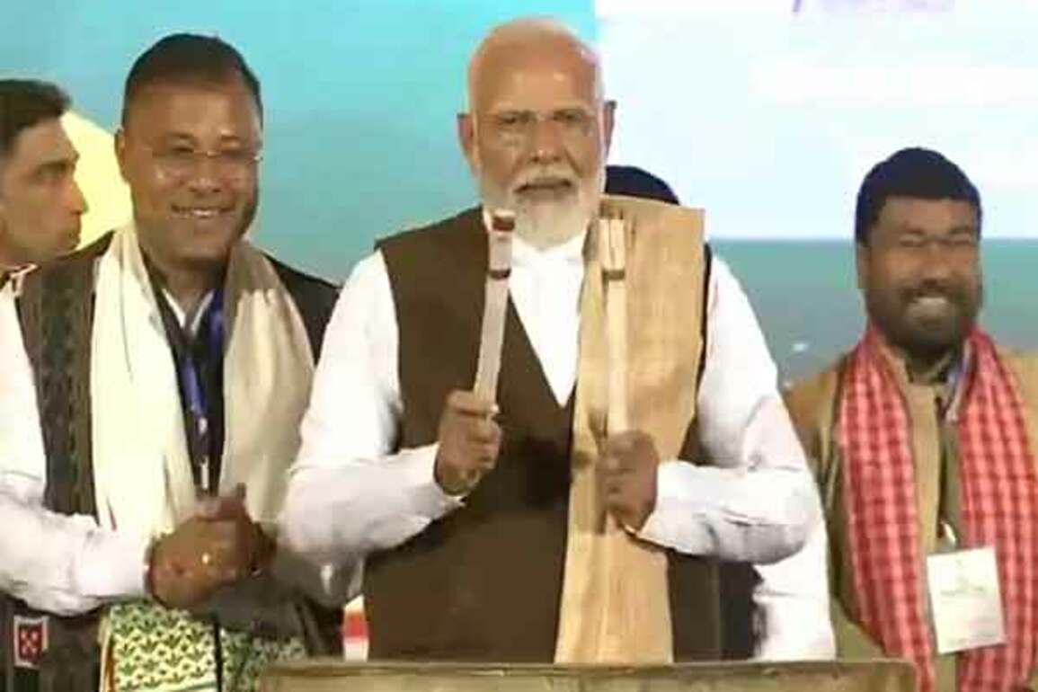 Prime Minister Narendra Modi beats traditional drum at 'Jhumoir Binandini' event in Assam