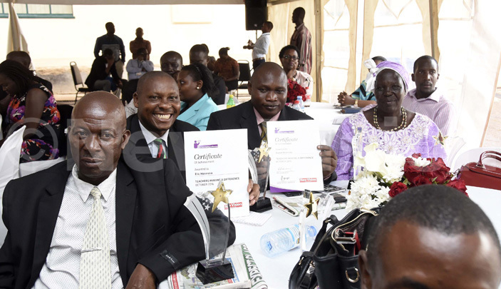  ric asereka 2nd left shows off his certificate 