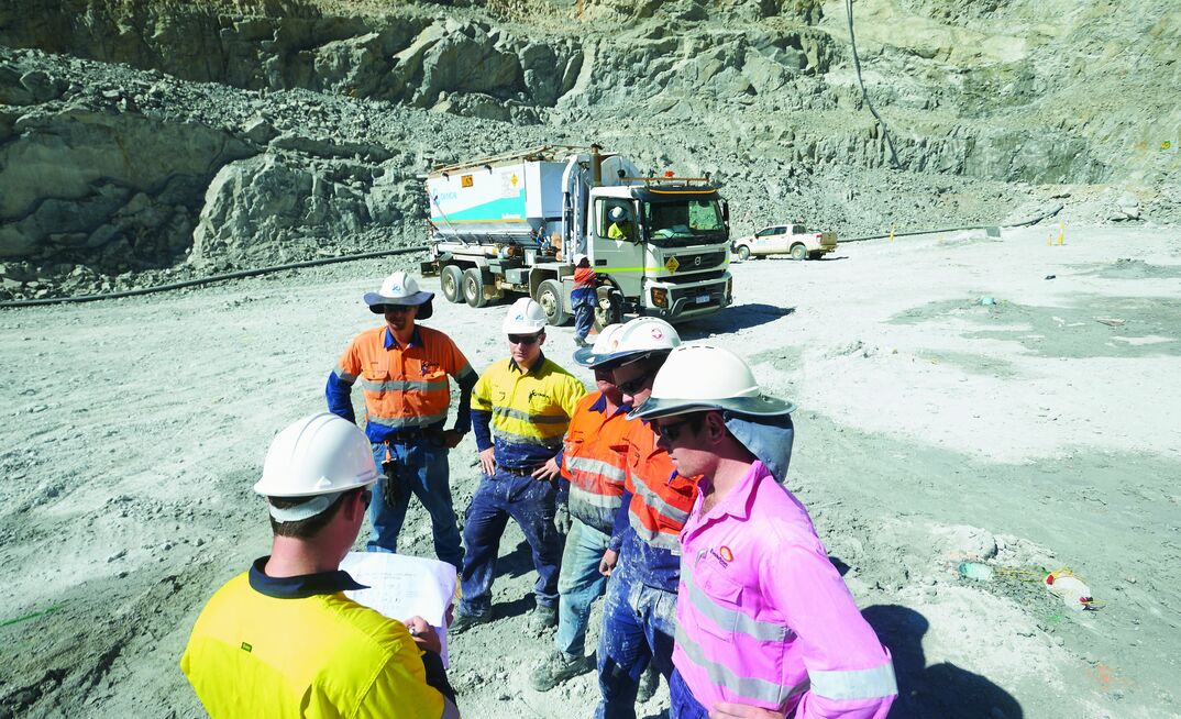 Orica and Evolution Mining staff on a Mt Rawdon bench.