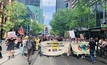  Protestors march on mining companies’ headquarters in Melbourne after trying to blockade a conference
