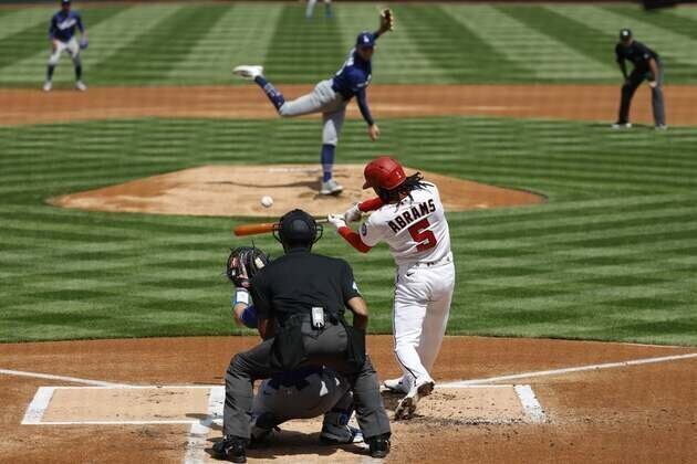 Dodgers hit five HRs, cruise to win in Nationals' home opener
