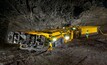 An operator using radio remote control for an Epiroc Mobile Miner 22H in an underground mine