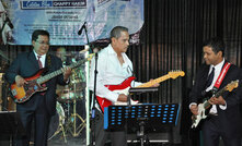 Chappy Hakim (centre) is a keen musician, according to his website