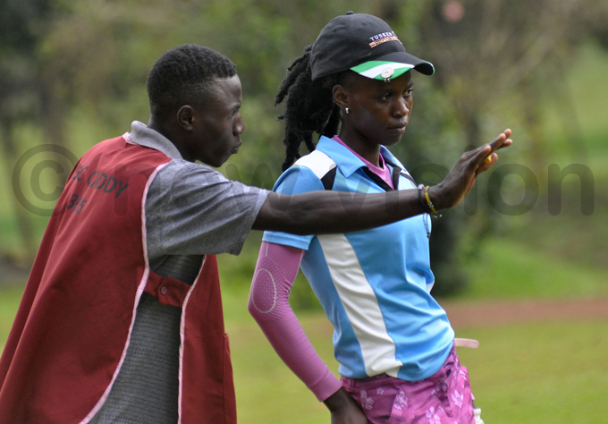 artha abiryes caddie lays strategies with her during day two at itante hoto by ichael subuga