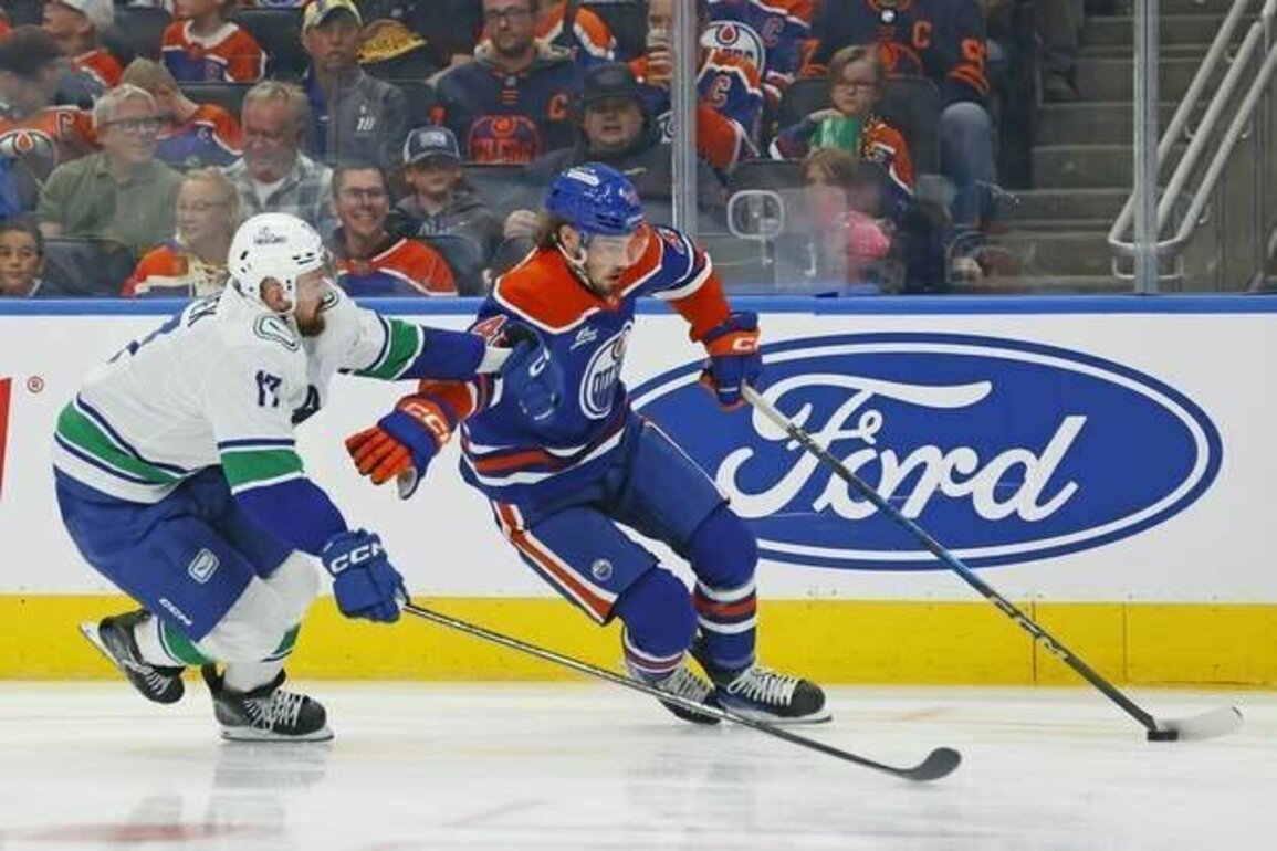 Oilers find scoring touch, hold off Canucks