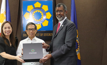  CAPTION: NEA director-general William Magwood, IV with former Philippines energy secretary Raphael Lotilla and undersecretary Sharon Garin.