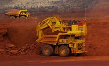 Two of the five AHS Komatsu trucks Rio Tinto trialled at Hope Downs.