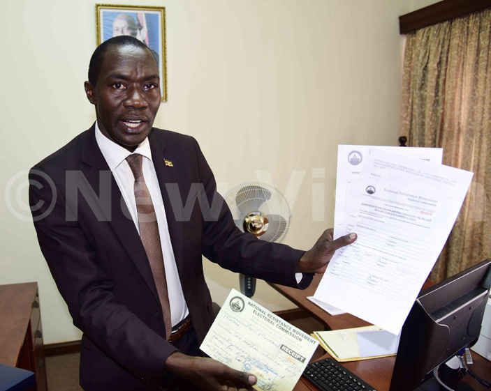 ewly elected   aul usamali shows the documents he picked to contest in elections hoto by ennedy ryema 